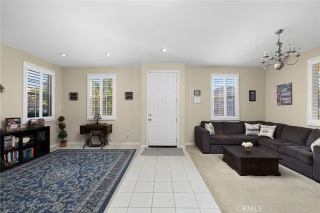 a living room with furniture rug and window
