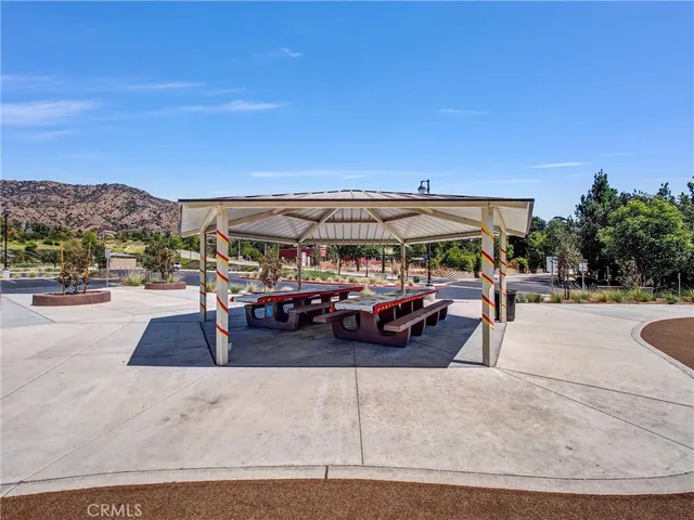 a view of a green field with an ocean view
