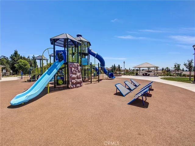 a view of a field with grass and trees