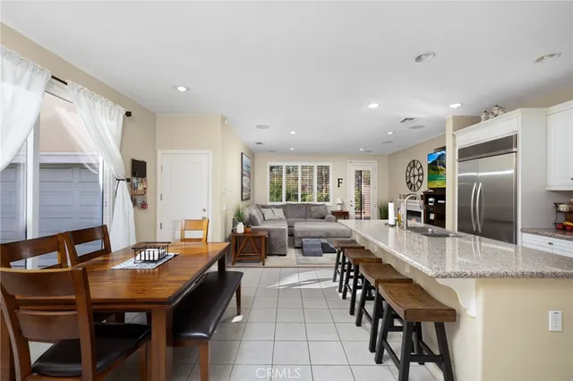 a large kitchen with a table and chairs