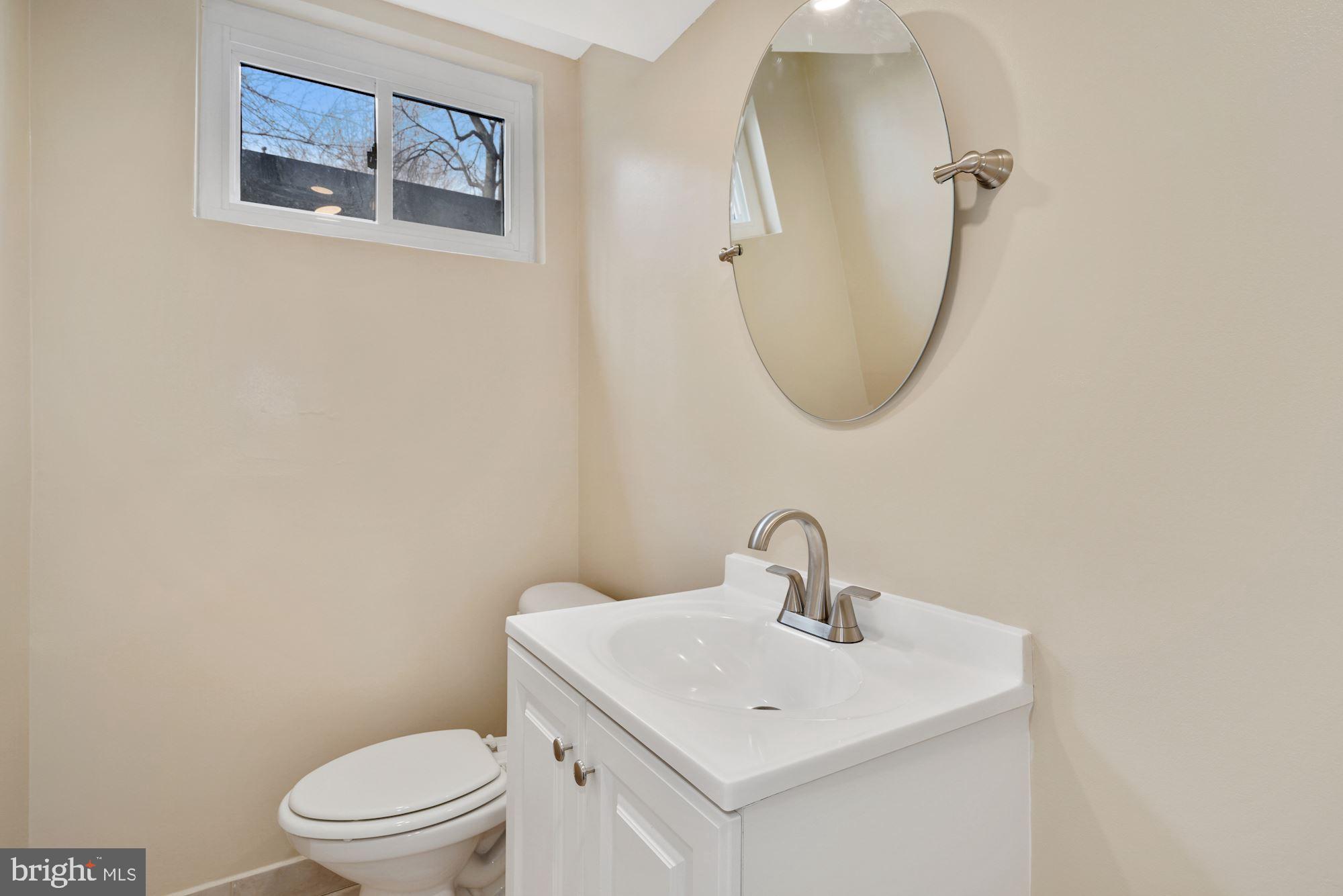 1821 Reedie Drive Silver Spring, MD 20902 - Photo 23 of 28 Lower Level Half Bath w new vanity, mirror& toilet