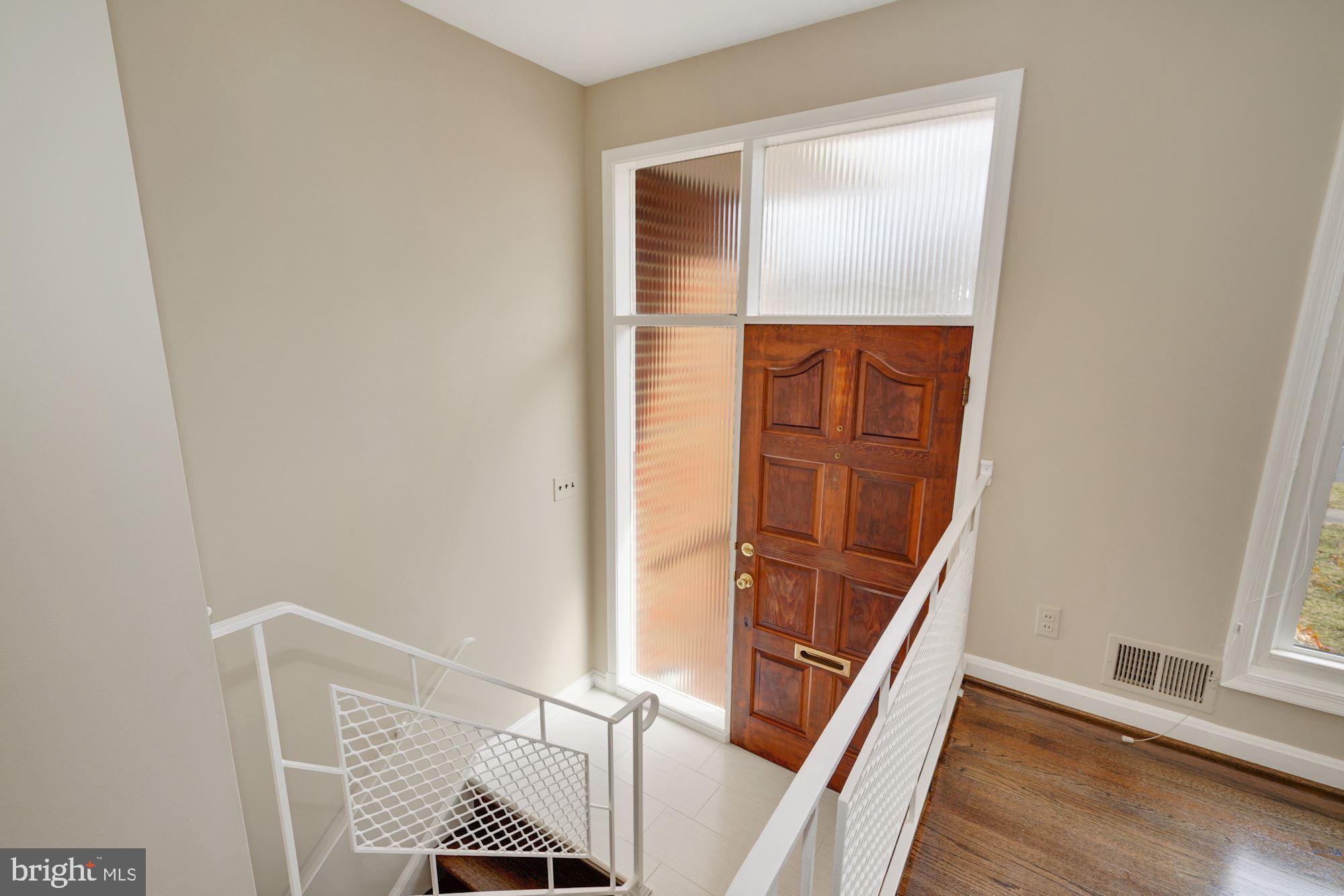 1821 Reedie Drive Silver Spring, MD 20902 - Photo 4 of 28 Open foyer with brand-new white tiled floor