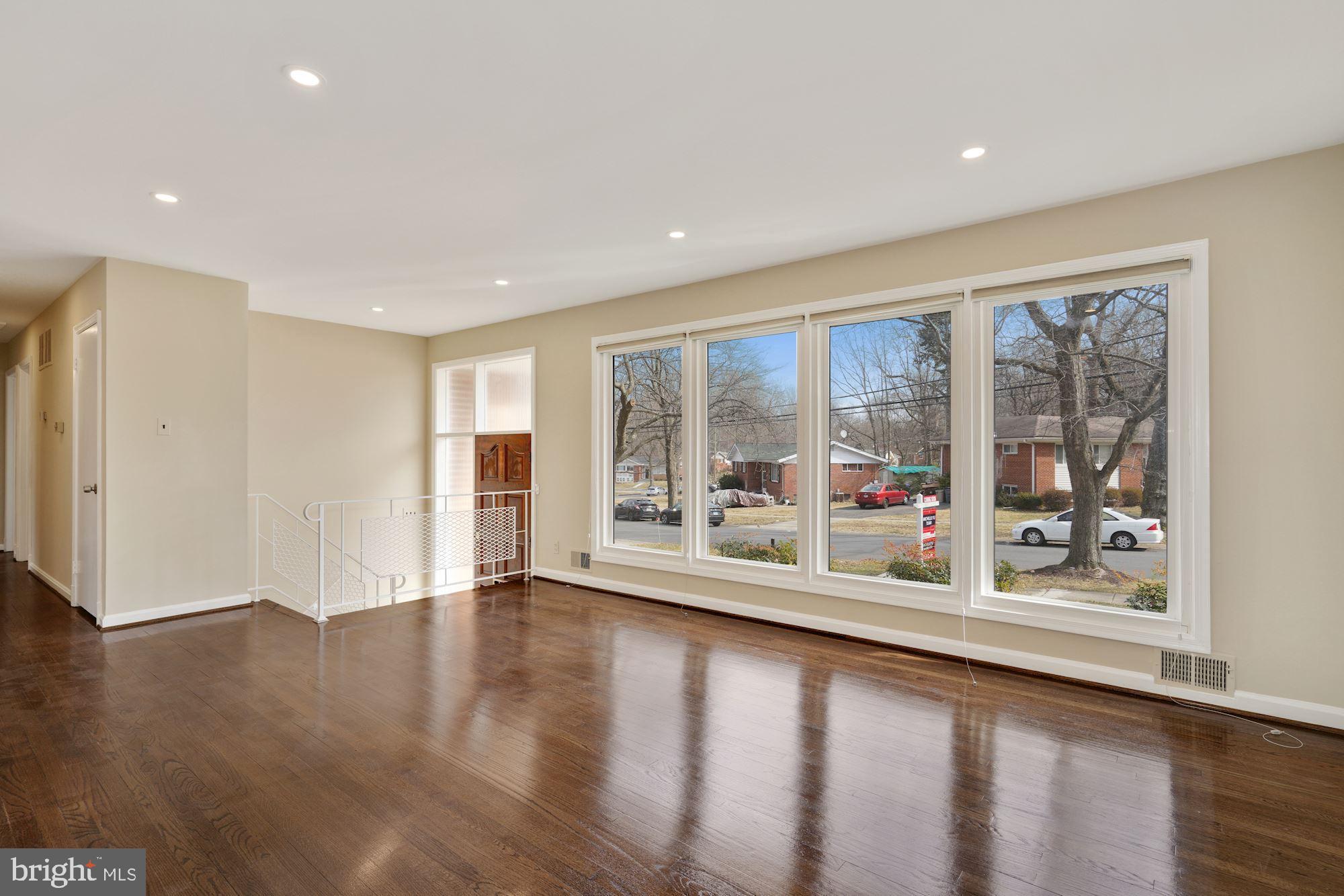 1821 Reedie Drive Silver Spring, MD 20902 - Photo 5 of 28 Living room w floor-to-ceiling picture windows