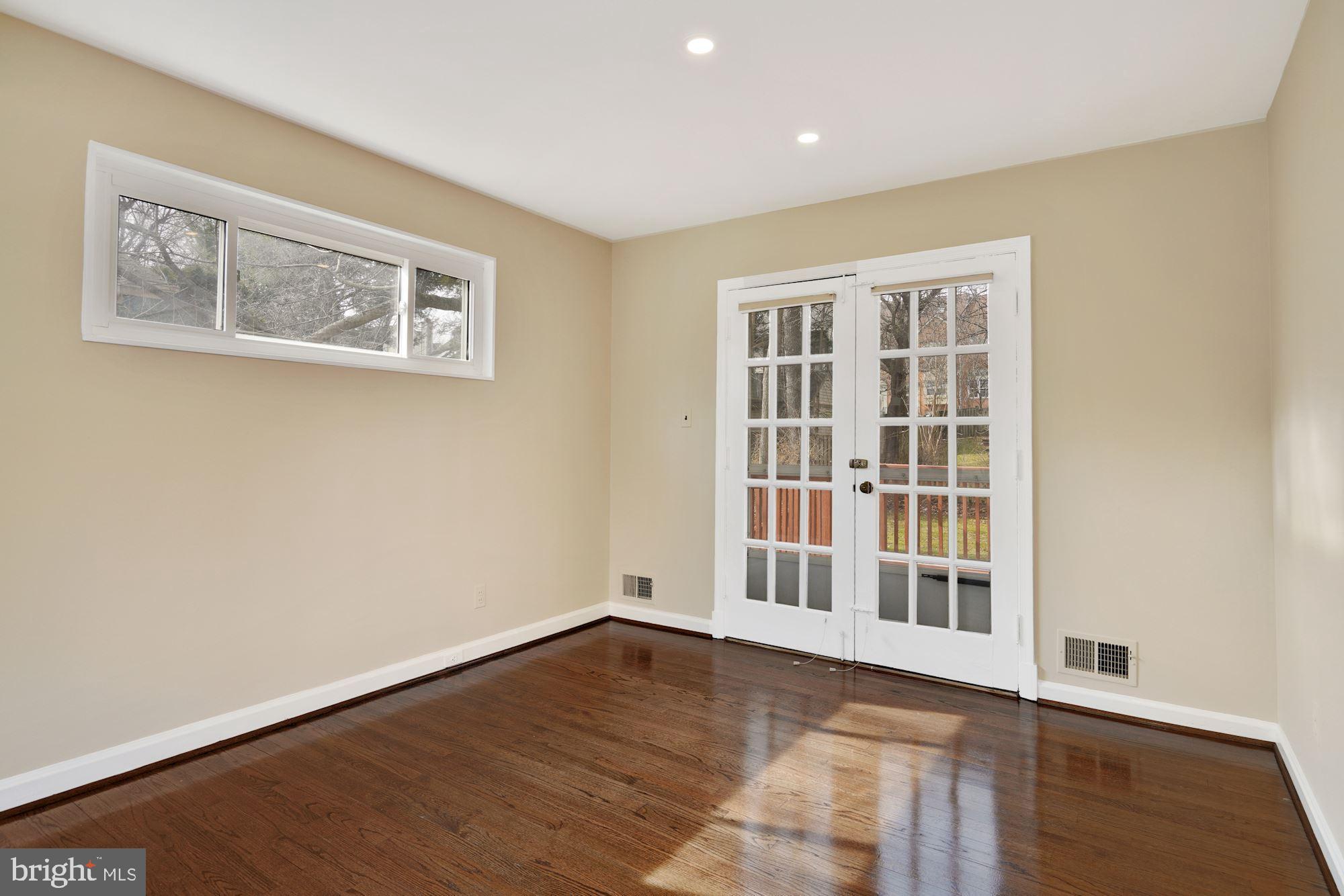 1821 Reedie Drive Silver Spring, MD 20902 - Photo 8 of 28 Dining Room w/high- placed windows & French doors