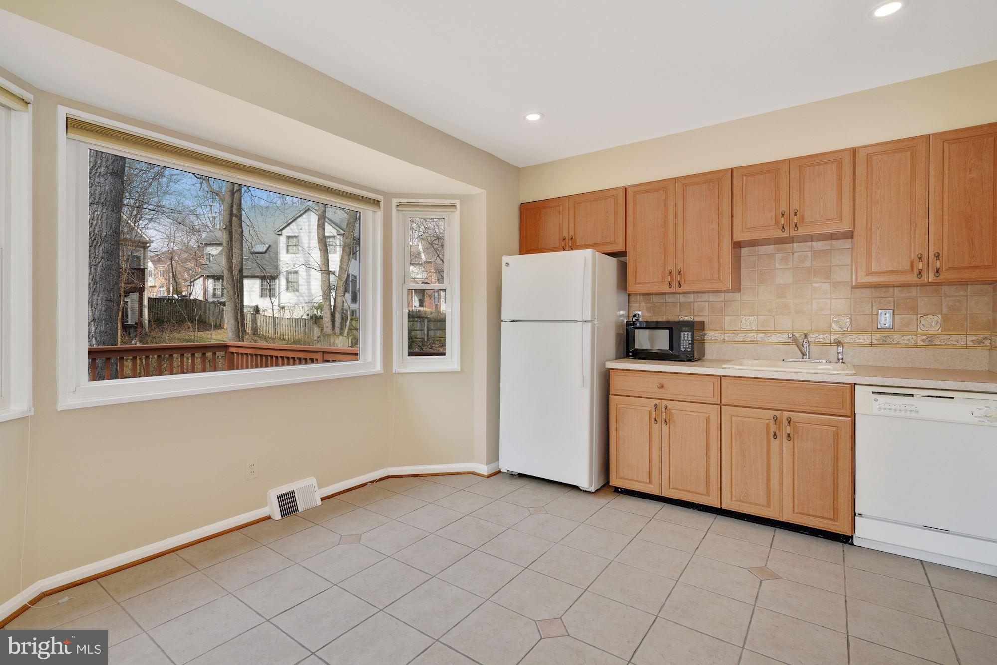 1821 Reedie Drive Silver Spring, MD 20902 - Photo 10 of 28 Spacious kitchen w neutral tiled flooring