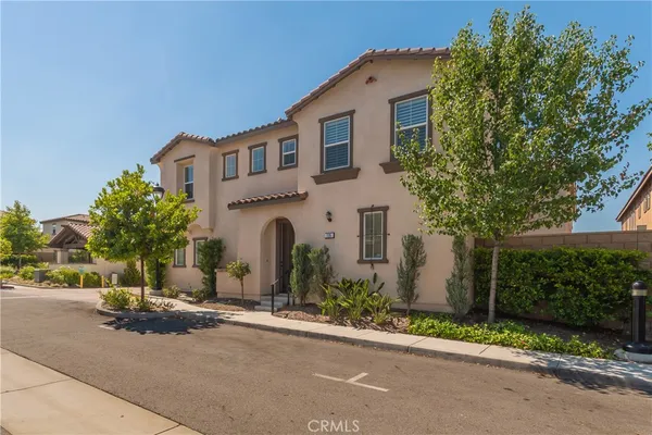 front view of a house with a street