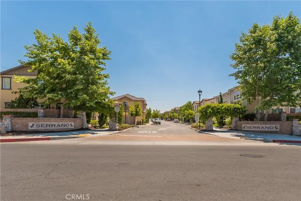 a view of outdoor space with signage and trees