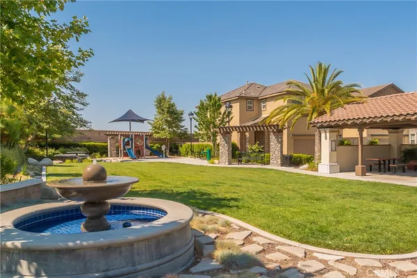 a view of a park with swings and slides