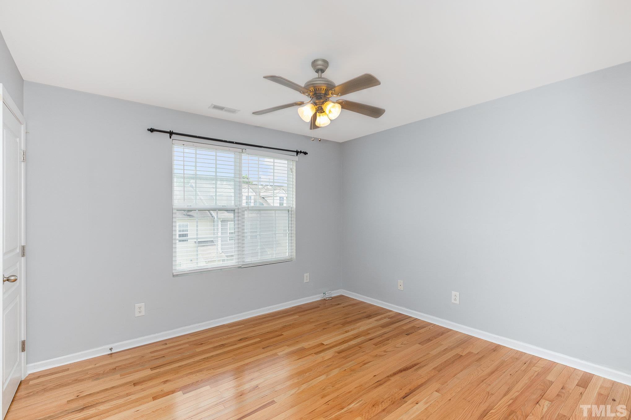 800 Bryant Street Raleigh, NC 27603 - Photo 14 of 20 a view of empty room with wooden floor and fan