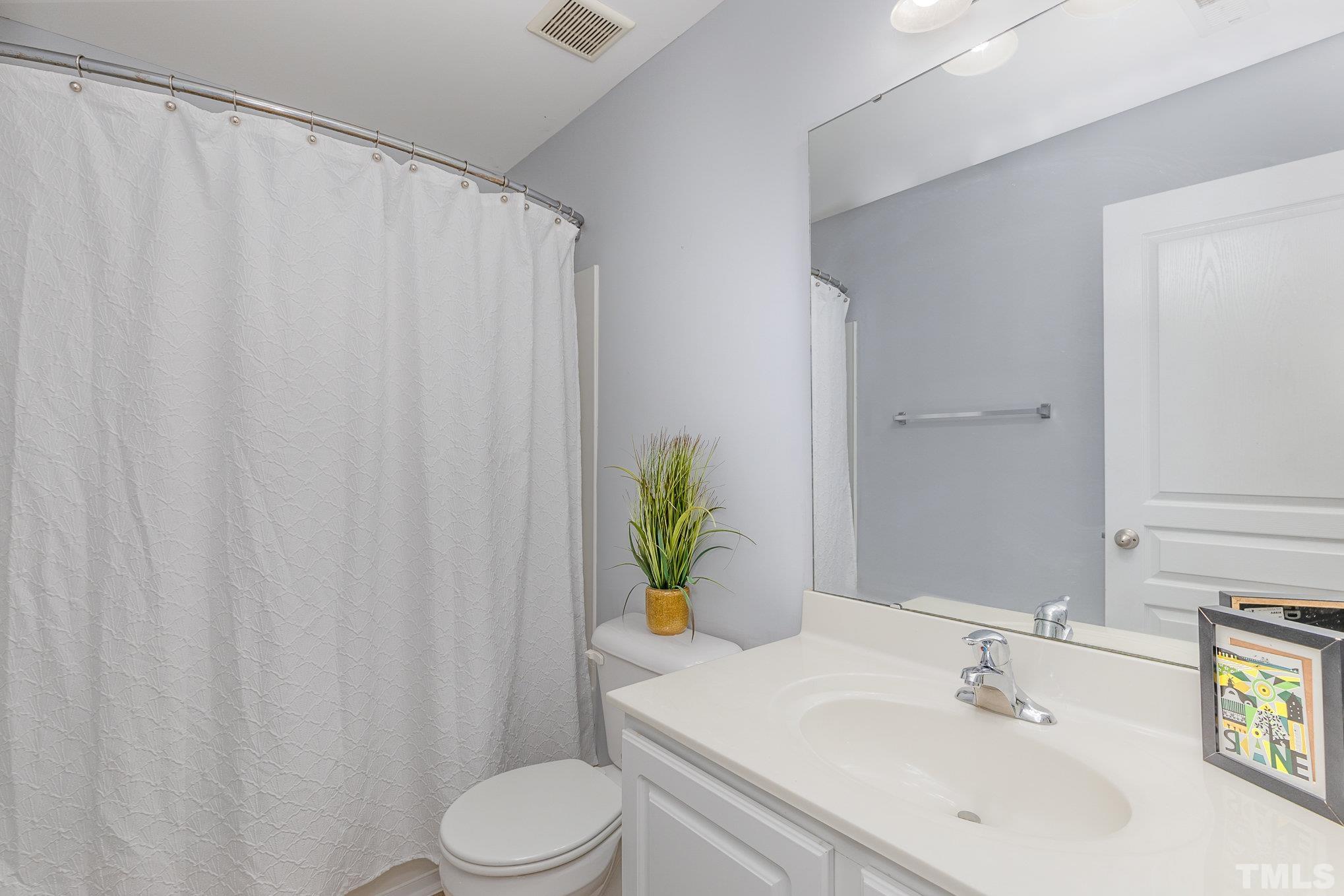 800 Bryant Street Raleigh, NC 27603 - Photo 16 of 20 a bathroom with a sink and a mirror