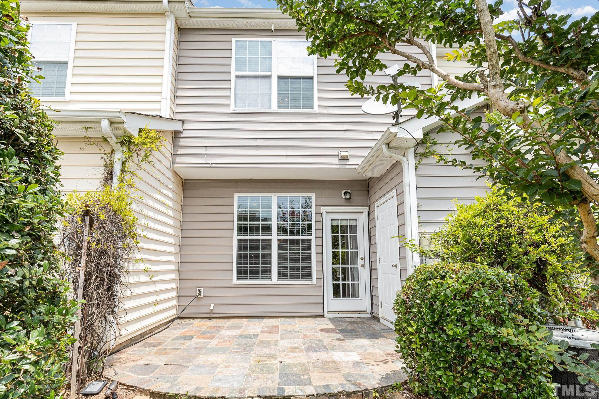 800 Bryant Street Raleigh, NC 27603 - Photo 17 of 20 a front view of a house with a yard and garage