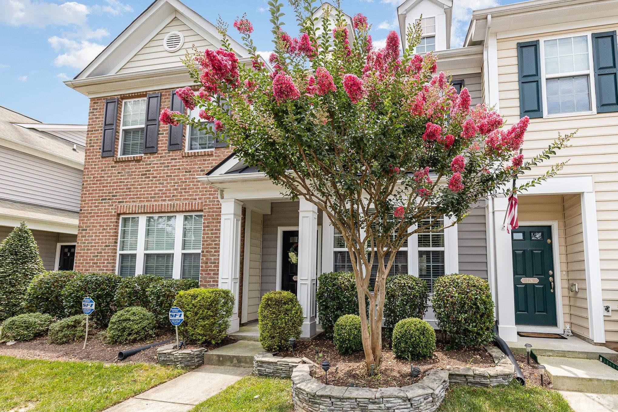 800 Bryant Street Raleigh, NC 27603 - Photo 2 of 20 a front view of a house with lots of flowers around