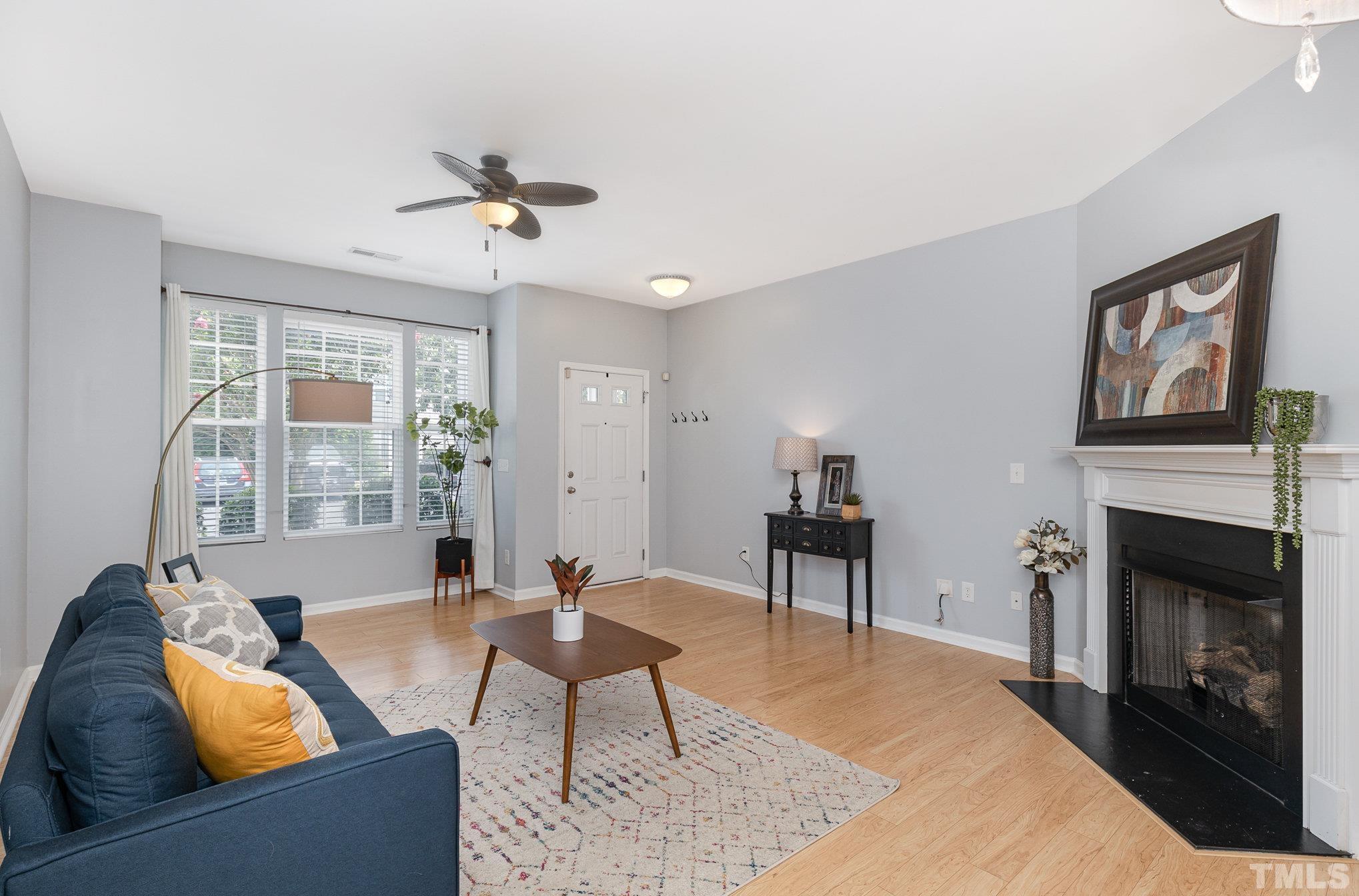 800 Bryant Street Raleigh, NC 27603 - Photo 5 of 20 a living room with furniture a window and a fireplace