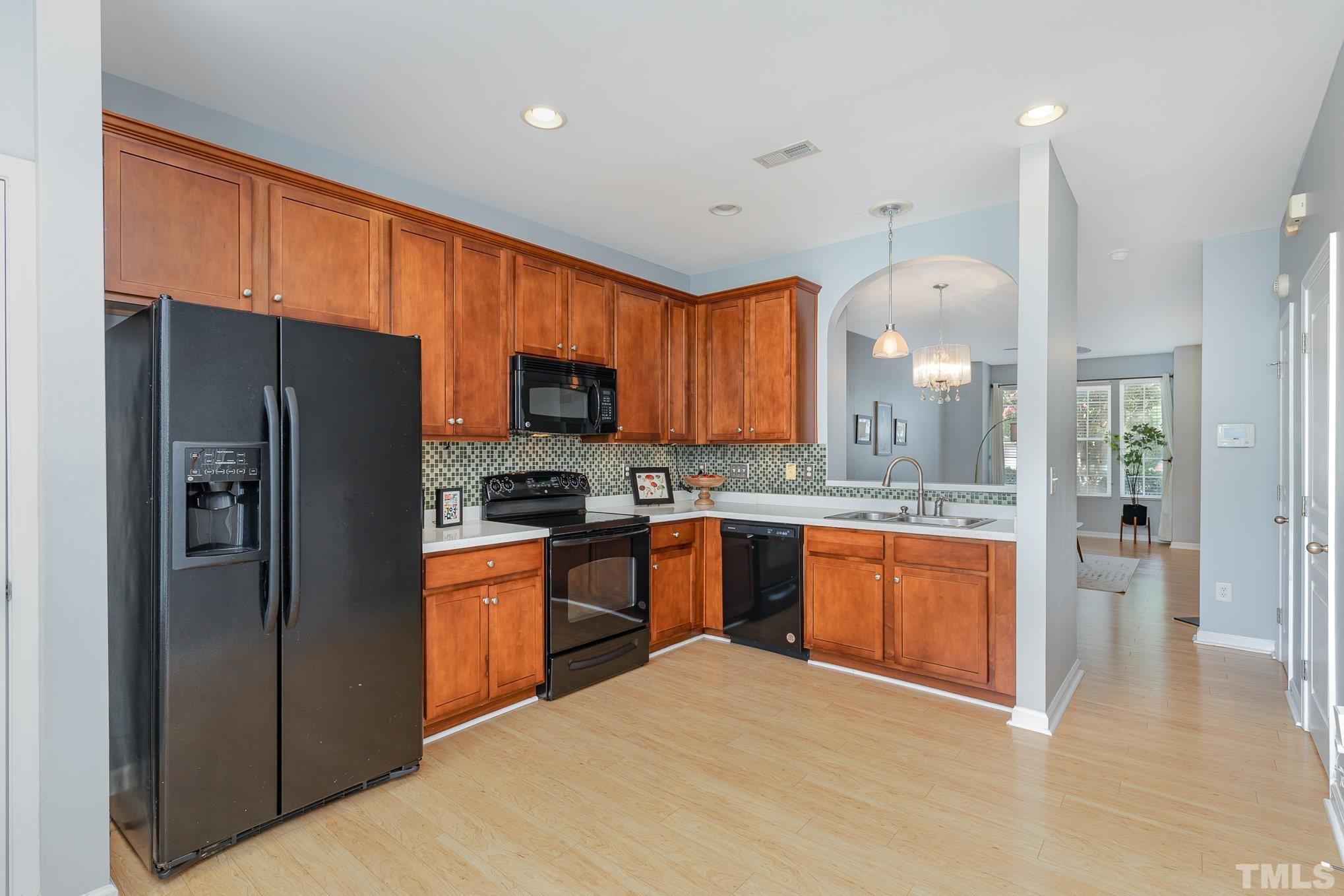 800 Bryant Street Raleigh, NC 27603 - Photo 6 of 20 a kitchen with stainless steel appliances granite countertop a refrigerator and a sink