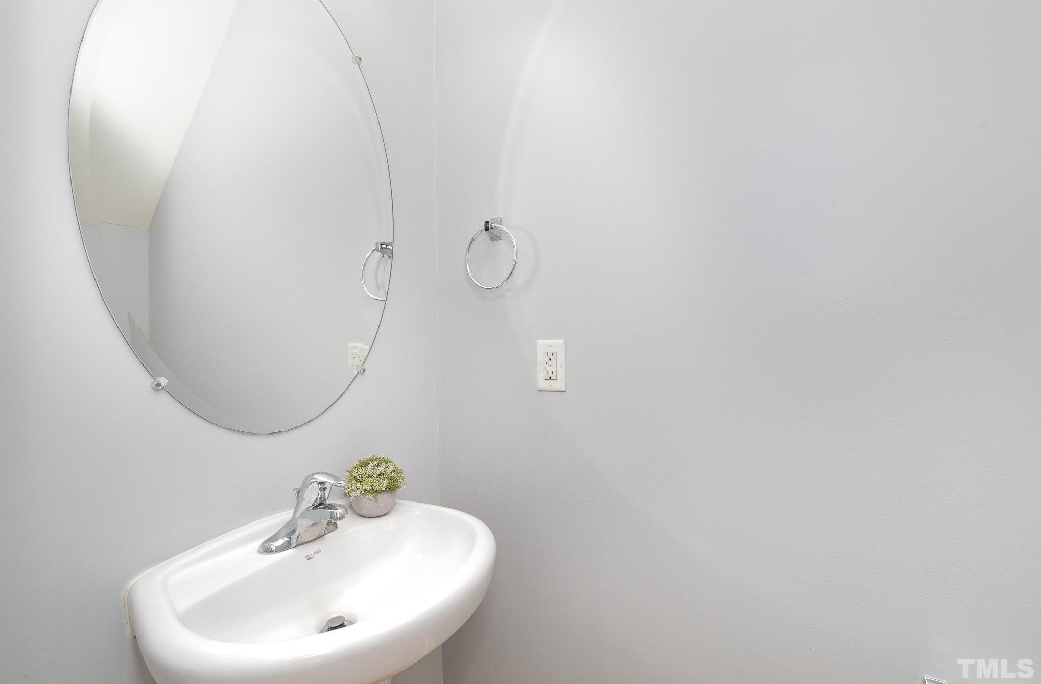 800 Bryant Street Raleigh, NC 27603 - Photo 10 of 20 a bathroom with a sink and a mirror
