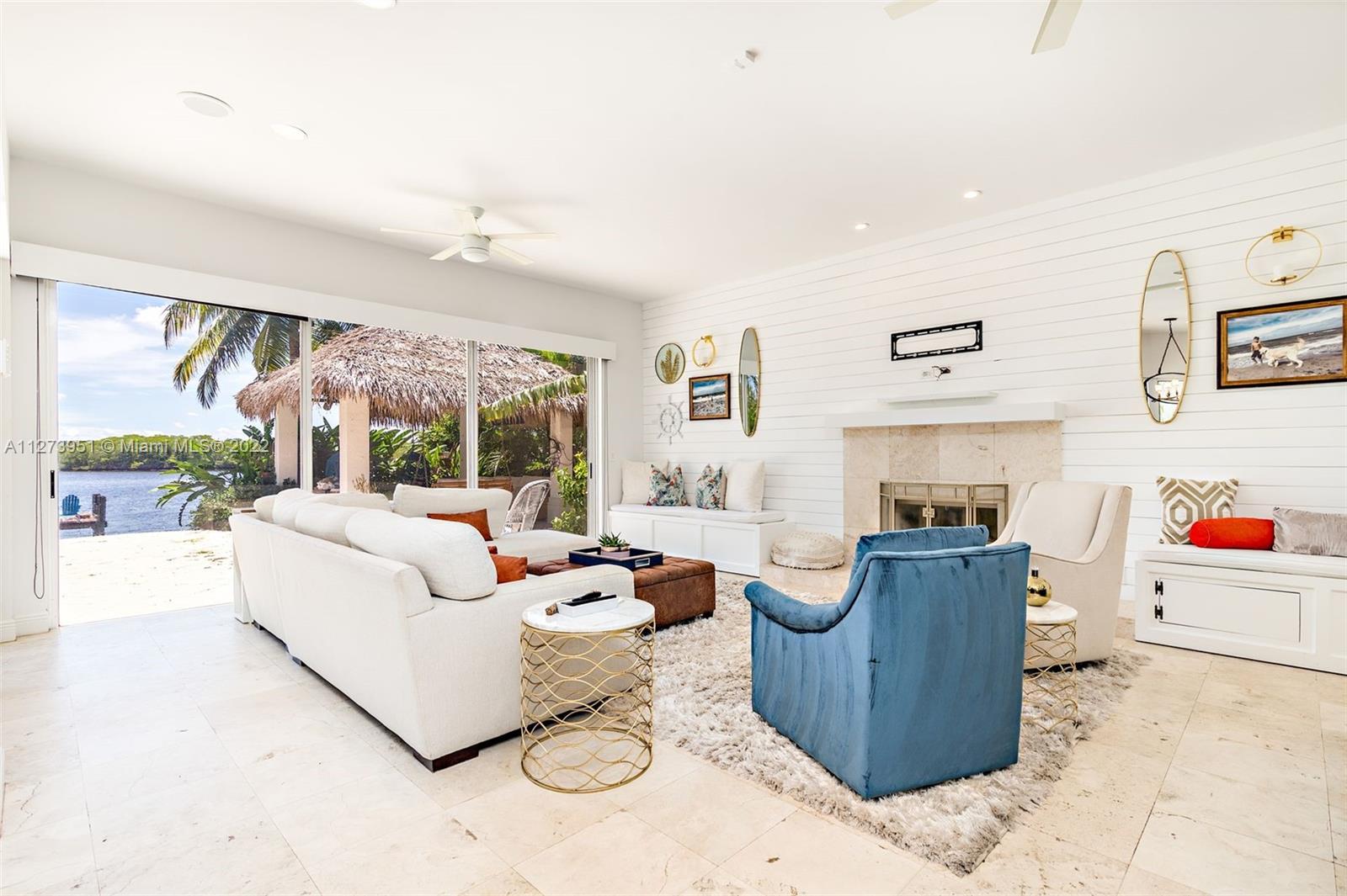 9460 Southeast Point Terrace Jupiter, FL 33469 - Photo 11 of 51 a living room with furniture and a large window