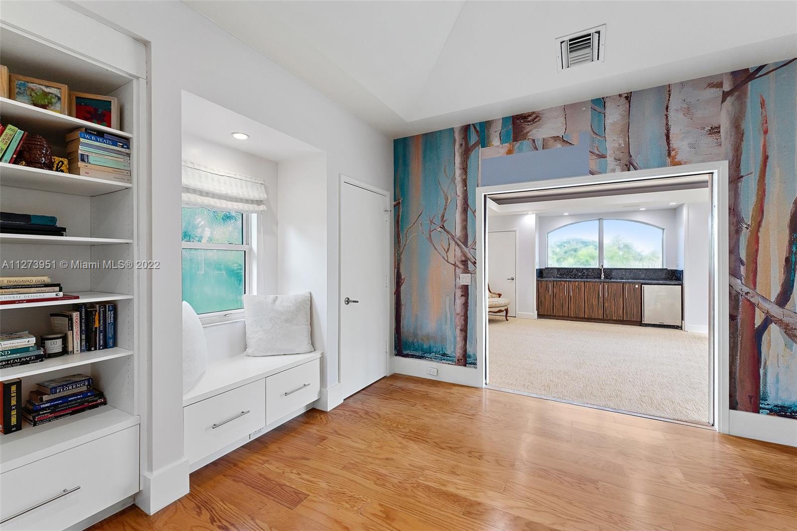 9460 Southeast Point Terrace Jupiter, FL 33469 - Photo 29 of 51 a view of an entryway with wooden floor and cabinets
