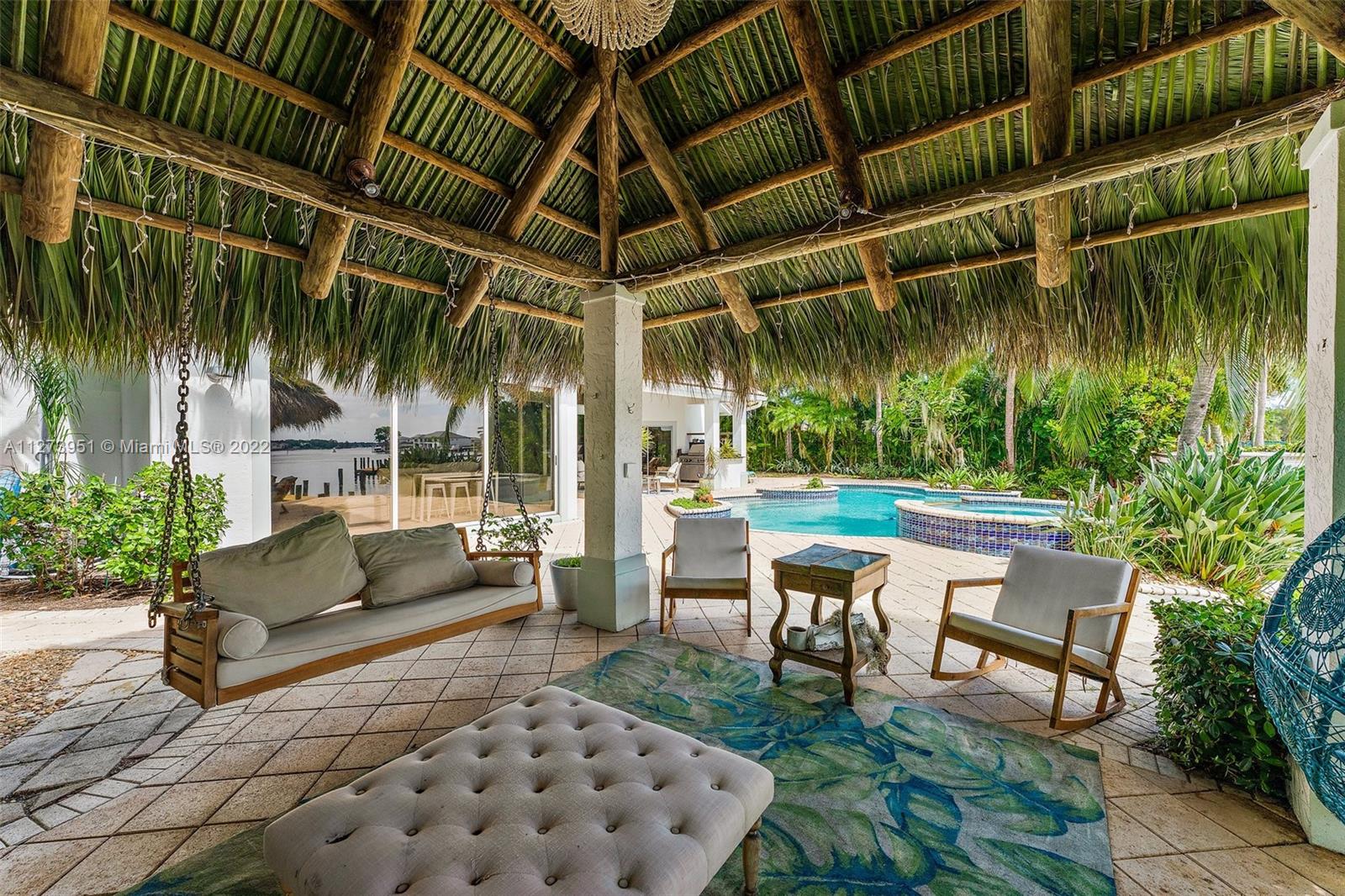 9460 Southeast Point Terrace Jupiter, FL 33469 - Photo 37 of 51 a patio with garden area and outdoor seating