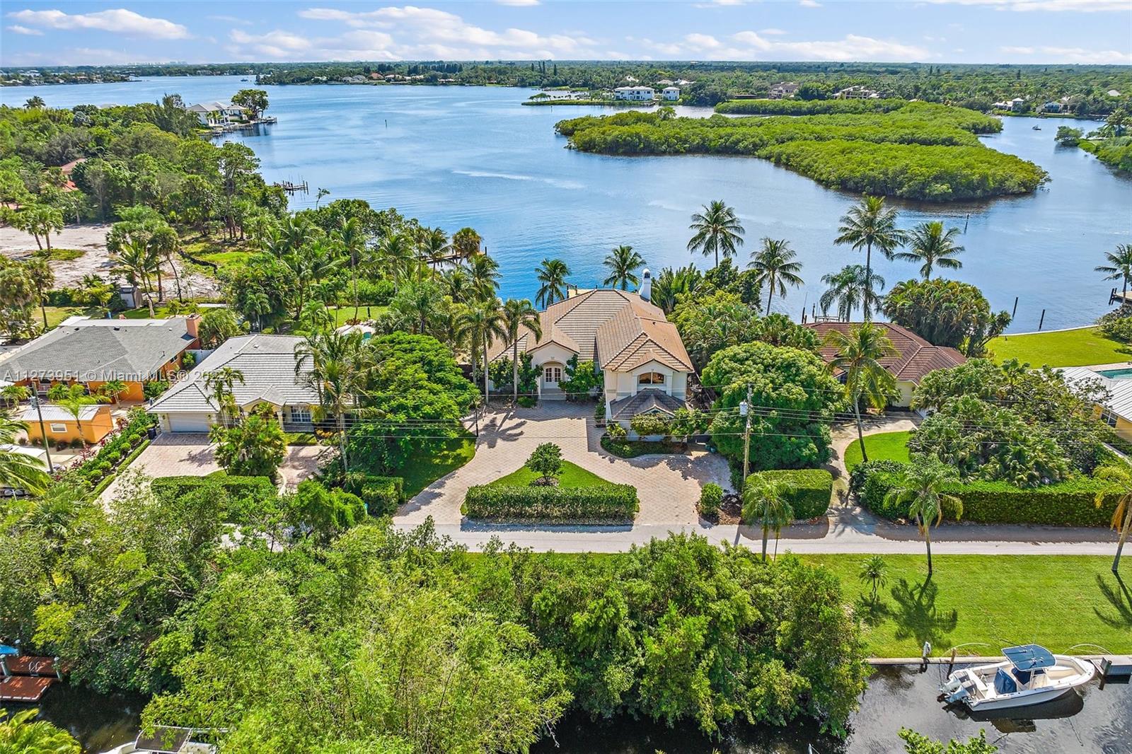 9460 Southeast Point Terrace Jupiter, FL 33469 - Photo 45 of 51 an aerial view of a house with outdoor space and lake view