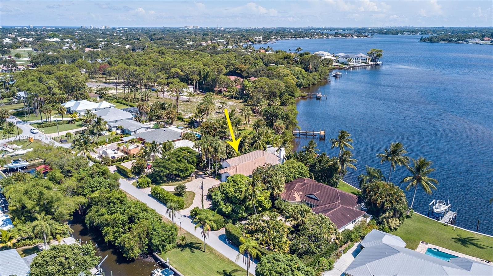 9460 Southeast Point Terrace Jupiter, FL 33469 - Photo 49 of 51 an aerial view of a houses with a yard