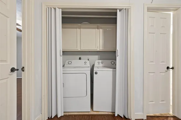 a view of bathroom with washer and dryer