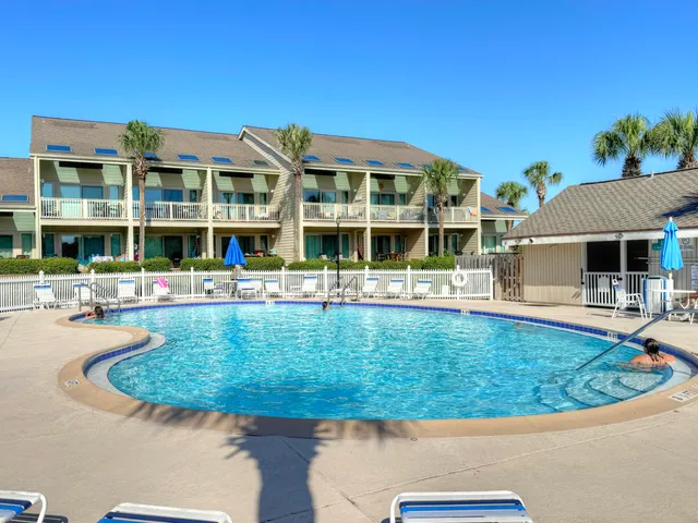 a view of a house with swimming pool