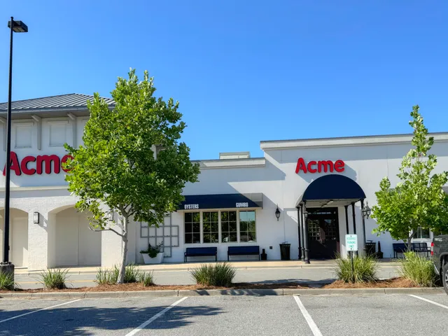 a front view of multi story residential apartment building with yard
