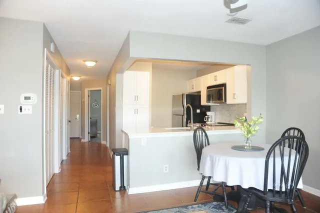 a view of a livingroom with furniture and windows