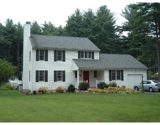 24 Old Stow Road Hudson, MA 01749 - Photo 2 of 15 a front view of a house with a garden