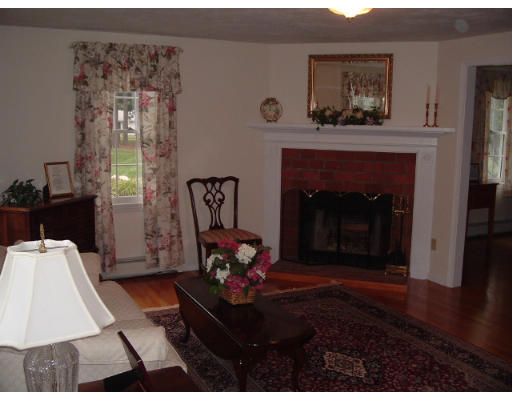 24 Old Stow Road Hudson, MA 01749 - Photo 4 of 15 a living room with furniture and a fireplace