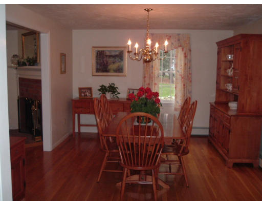 24 Old Stow Road Hudson, MA 01749 - Photo 6 of 15 a view of a dining room with furniture and chandelier