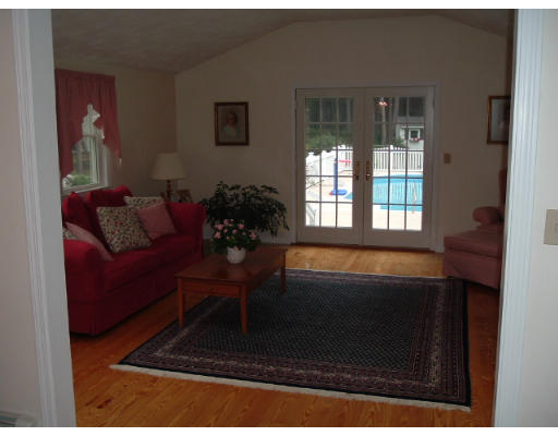 24 Old Stow Road Hudson, MA 01749 - Photo 7 of 15 a living room with furniture and a potted plant