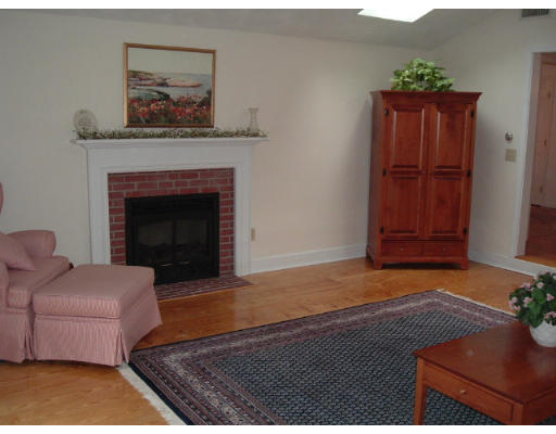 24 Old Stow Road Hudson, MA 01749 - Photo 8 of 15 a living room with furniture and a fireplace