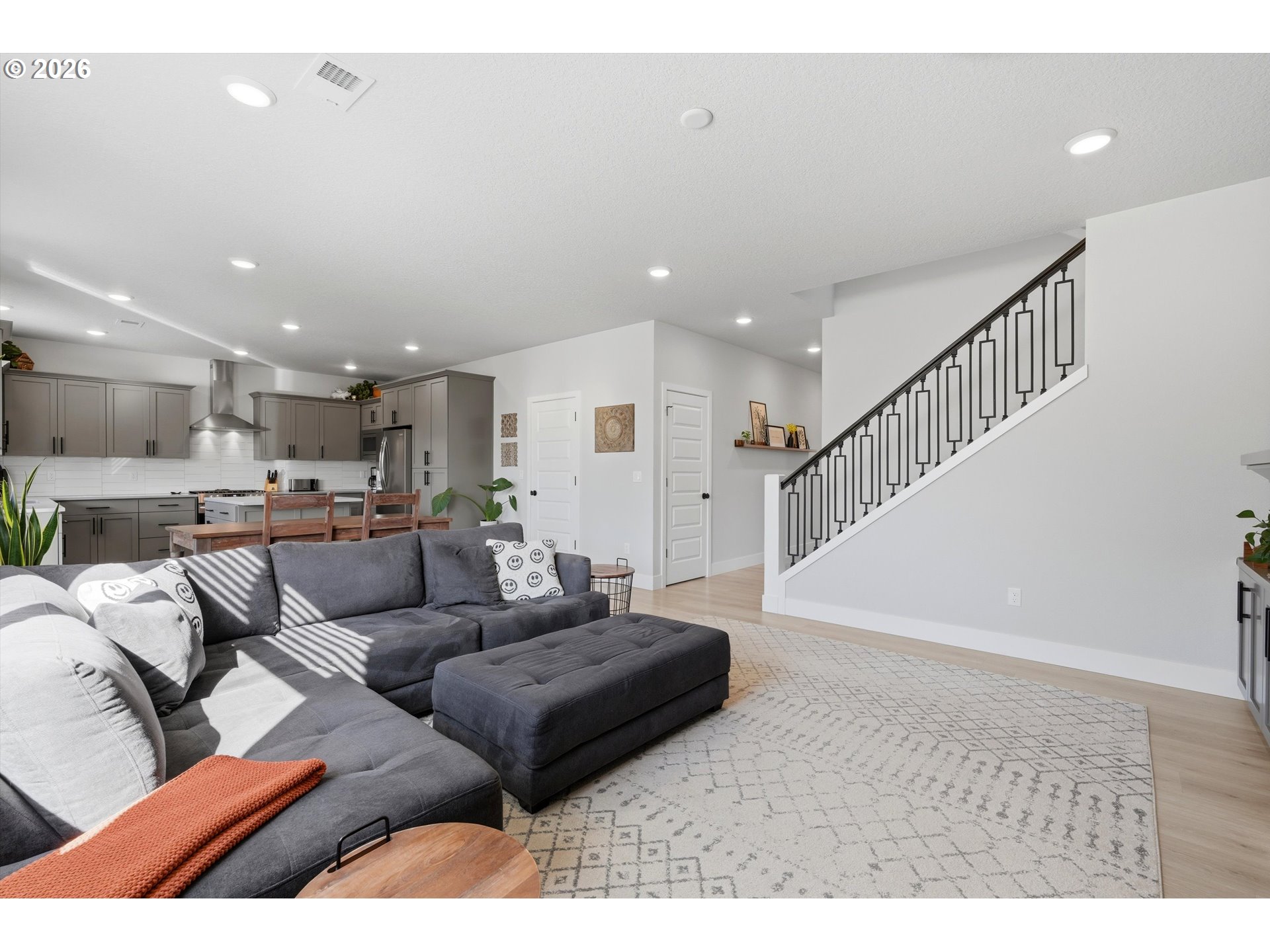 14589 Southwest Jensen Terrace Portland, OR 97224 - Photo 11 of 42 a living room with furniture and a view of kitchen