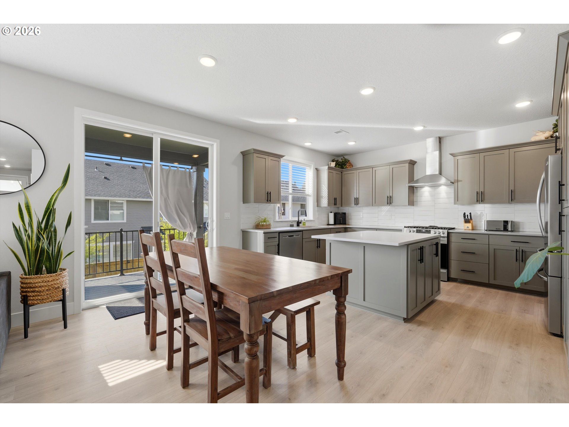 14589 Southwest Jensen Terrace Portland, OR 97224 - Photo 13 of 42 a kitchen with a table and chairs