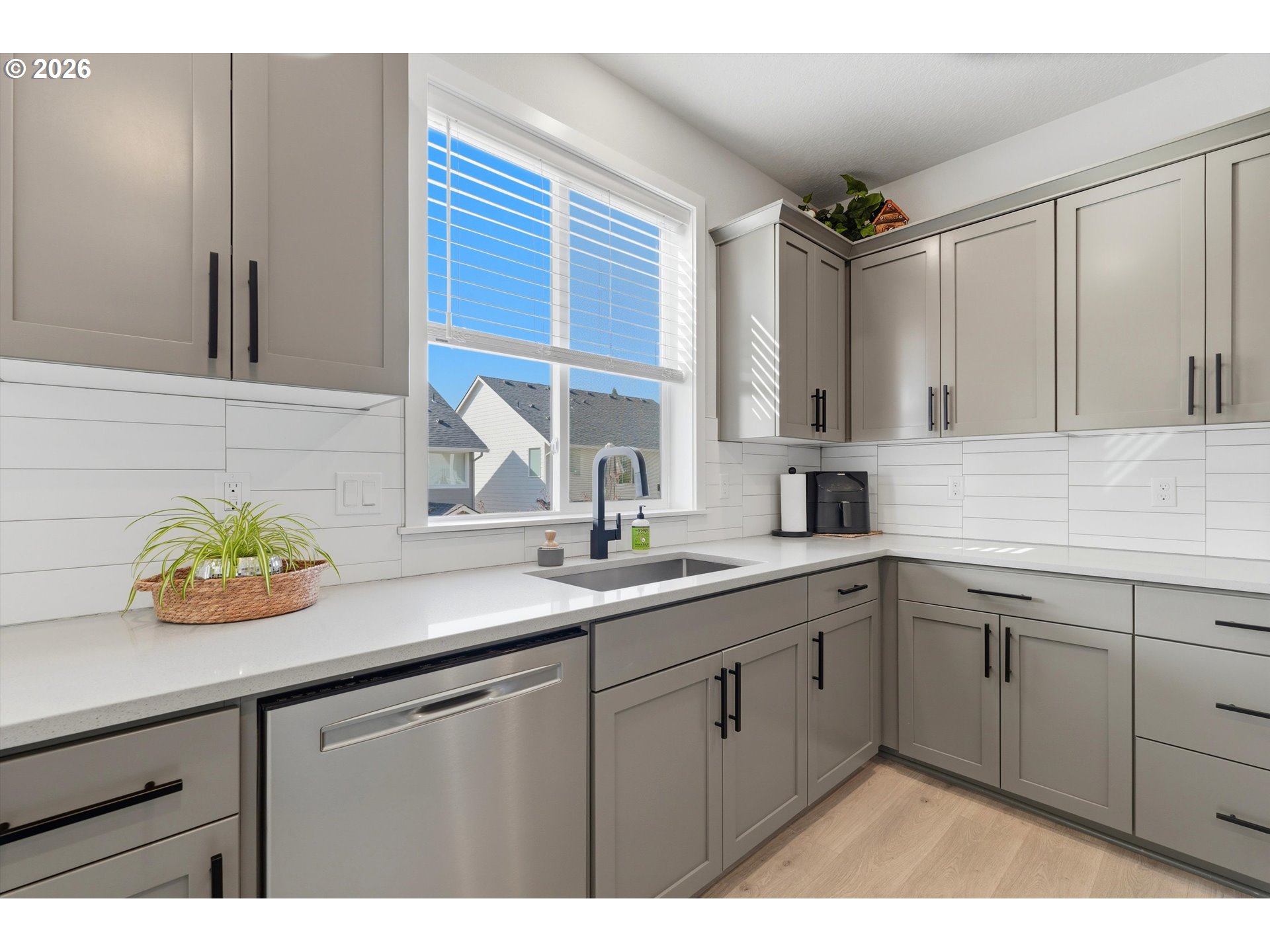 14589 Southwest Jensen Terrace Portland, OR 97224 - Photo 17 of 42 a kitchen with a sink and a window