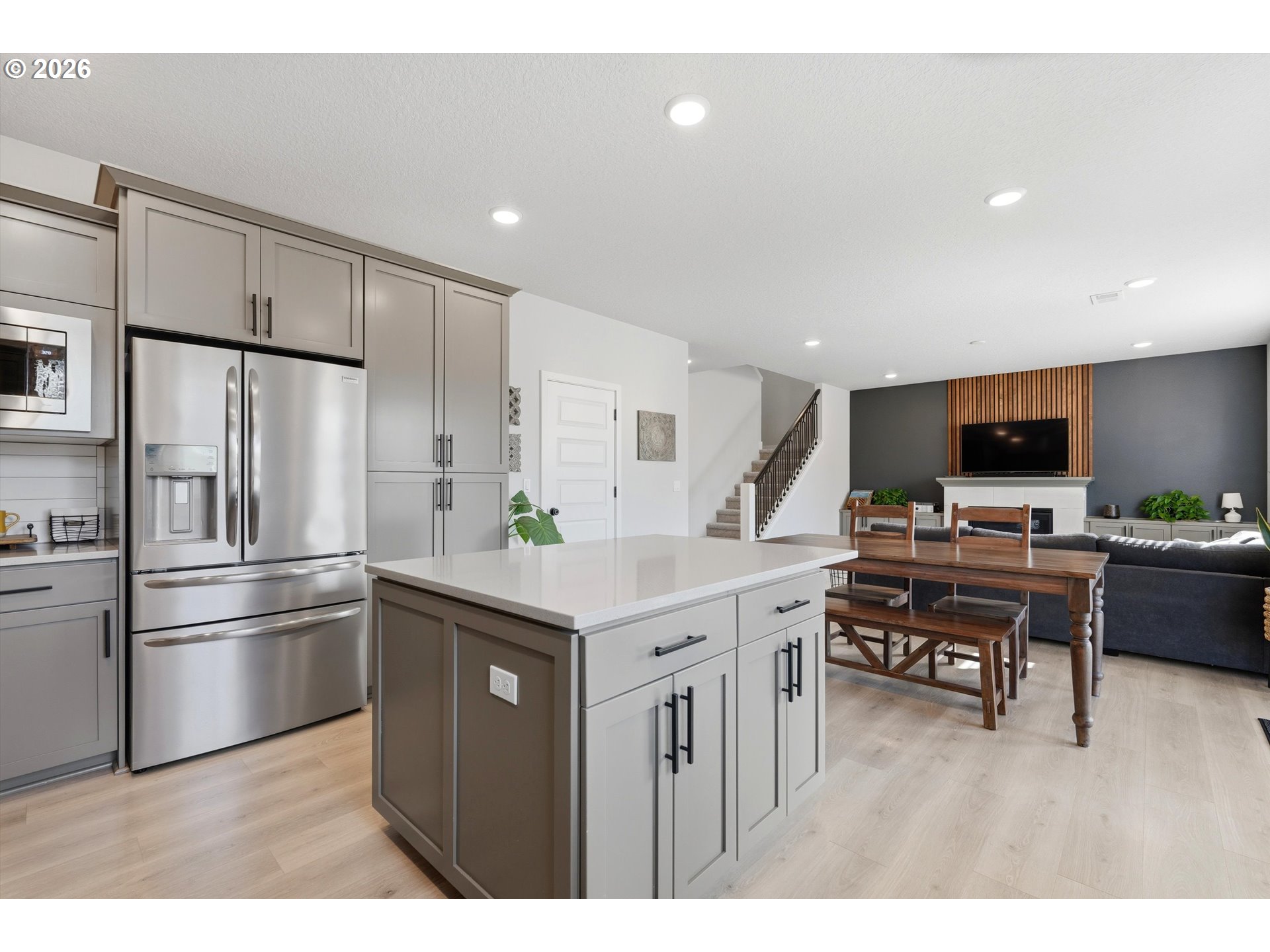14589 Southwest Jensen Terrace Portland, OR 97224 - Photo 19 of 42 a kitchen with kitchen island a sink stainless steel appliances and cabinets