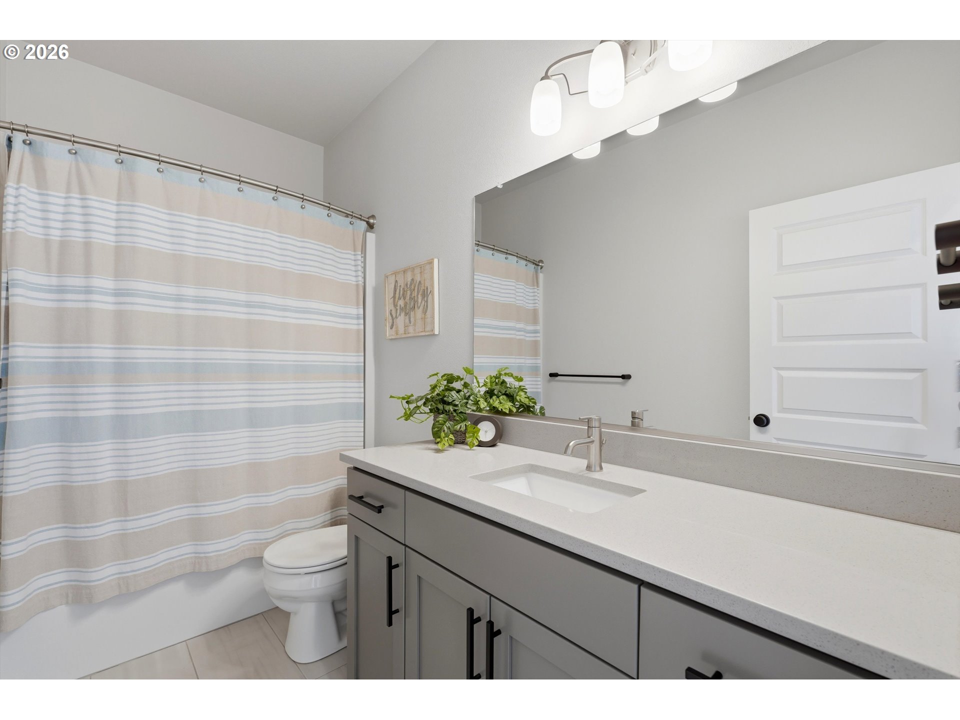 14589 Southwest Jensen Terrace Portland, OR 97224 - Photo 21 of 42 a bathroom with a sink a toilet and shower