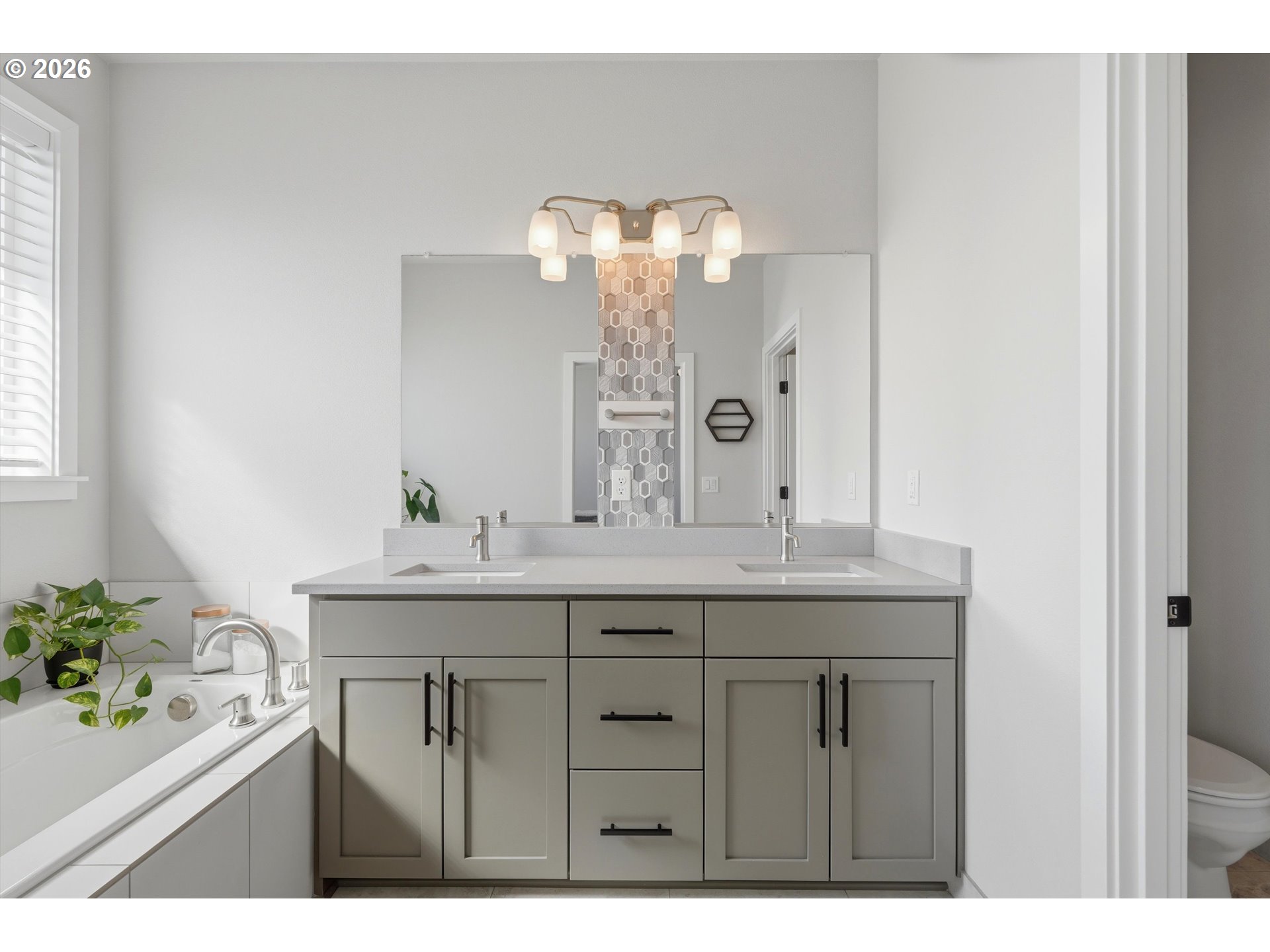 14589 Southwest Jensen Terrace Portland, OR 97224 - Photo 28 of 42 a bathroom with a double vanity sink and a mirror