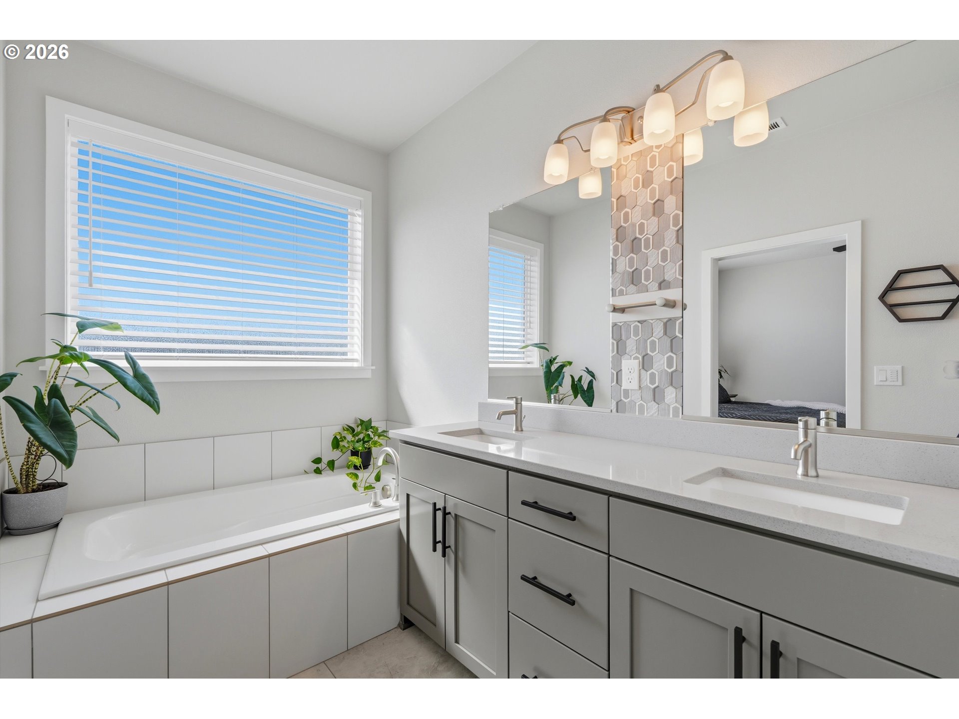 14589 Southwest Jensen Terrace Portland, OR 97224 - Photo 29 of 42 a bathroom with a bathtub a sink and a mirror