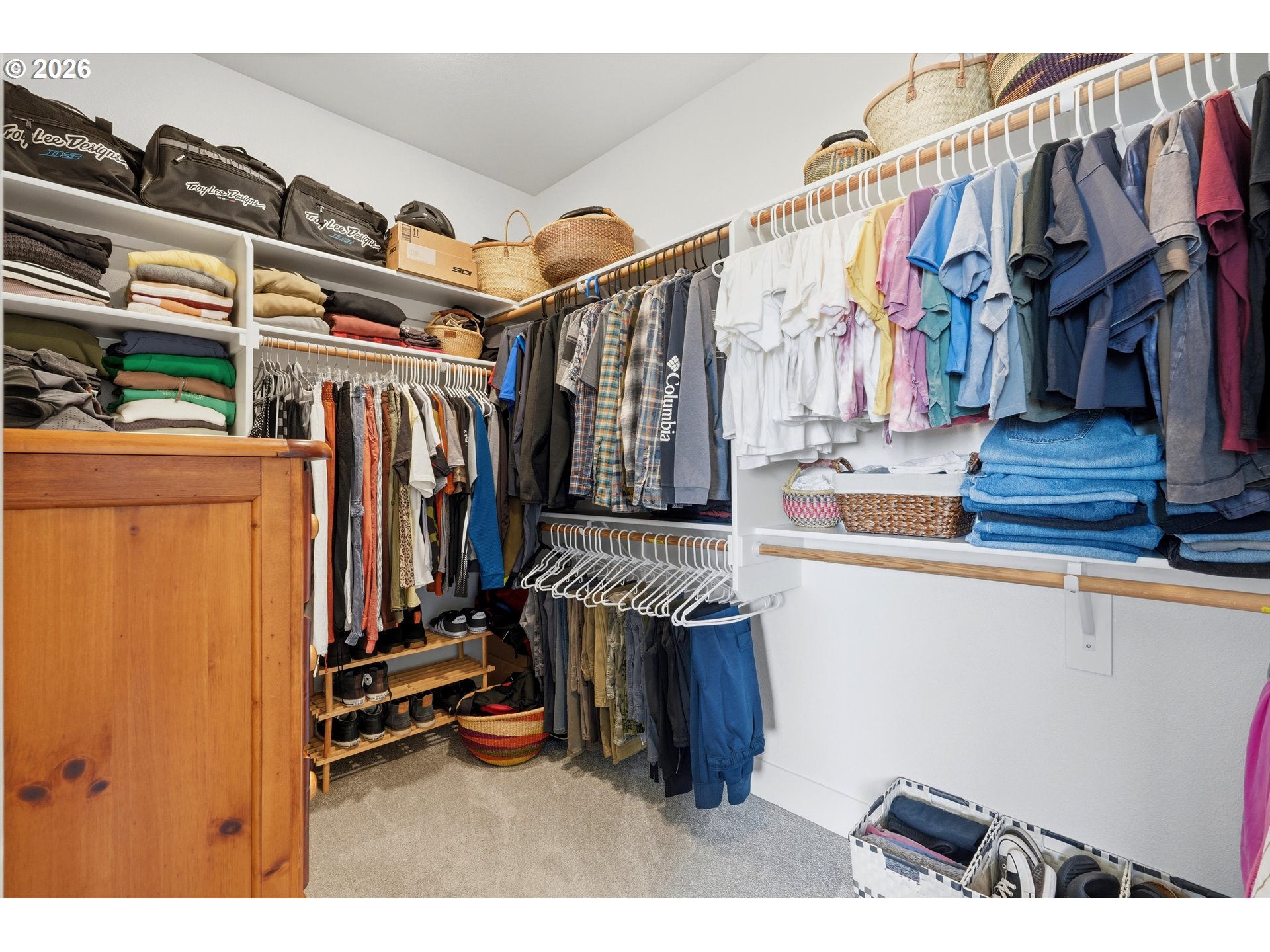 14589 Southwest Jensen Terrace Portland, OR 97224 - Photo 31 of 42 a view of walk in closet with clothes and shoes
