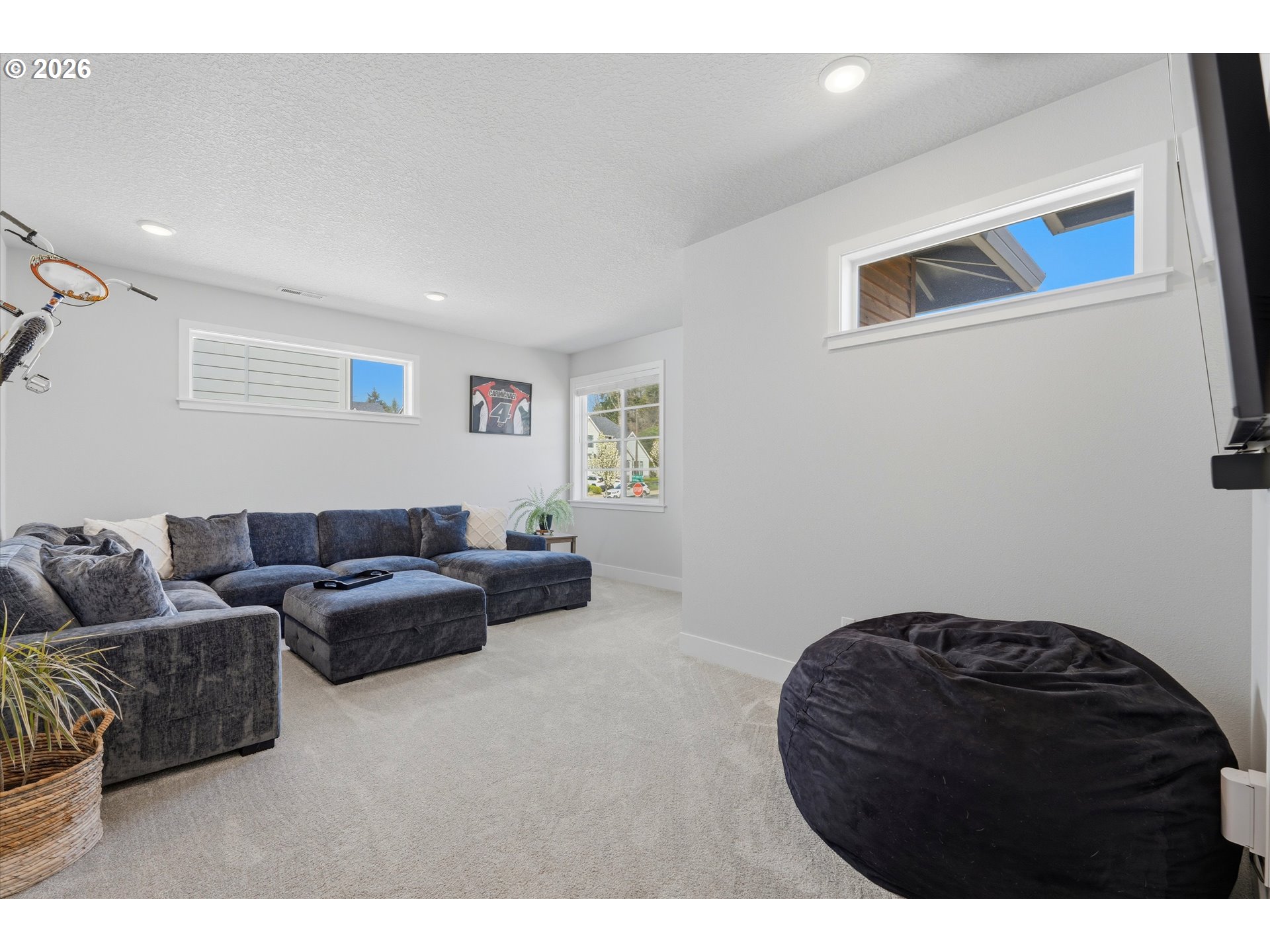 14589 Southwest Jensen Terrace Portland, OR 97224 - Photo 32 of 42 a living room with furniture and a rug