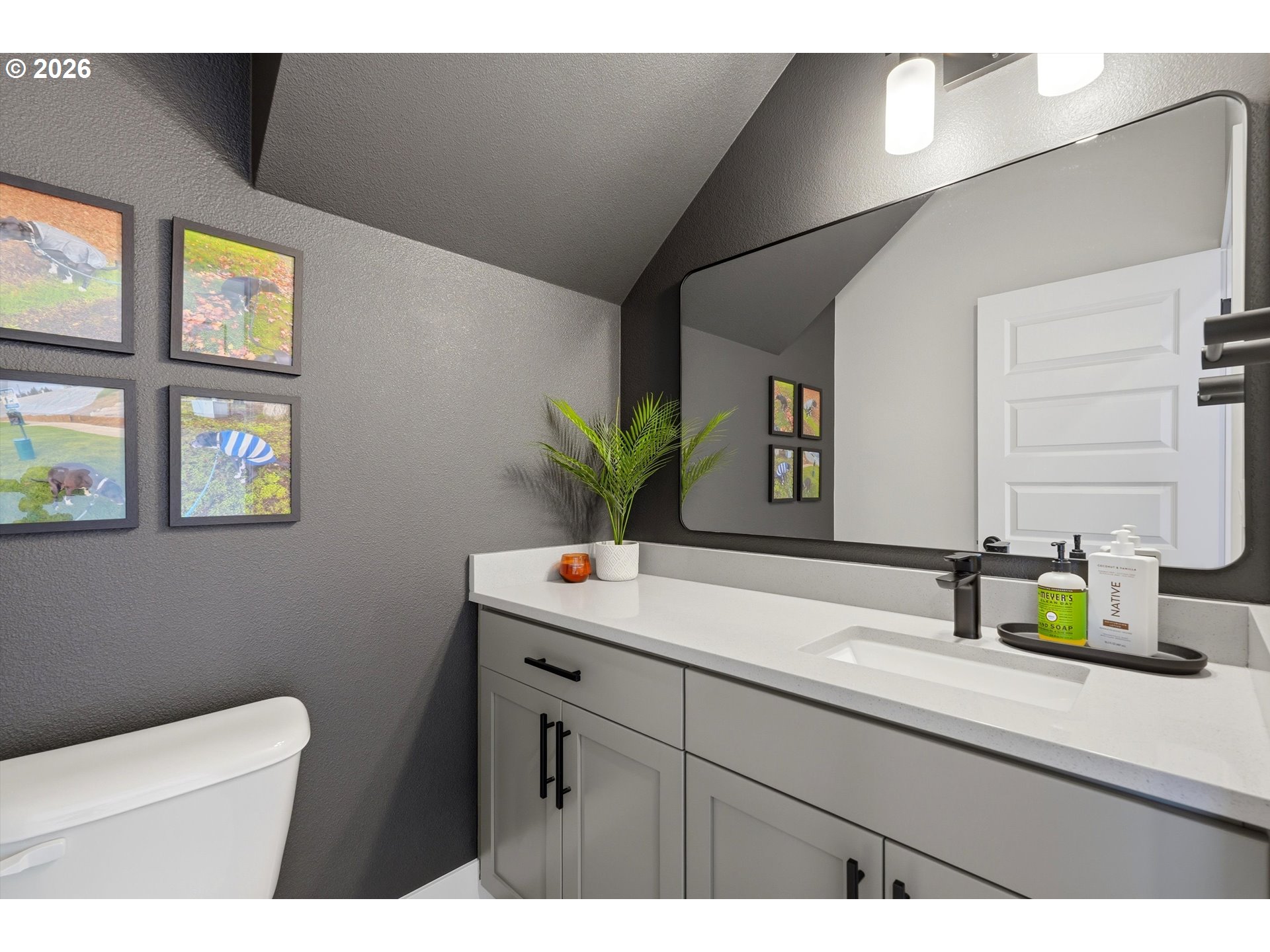 14589 Southwest Jensen Terrace Portland, OR 97224 - Photo 8 of 42 a bathroom with a sink and a toilet