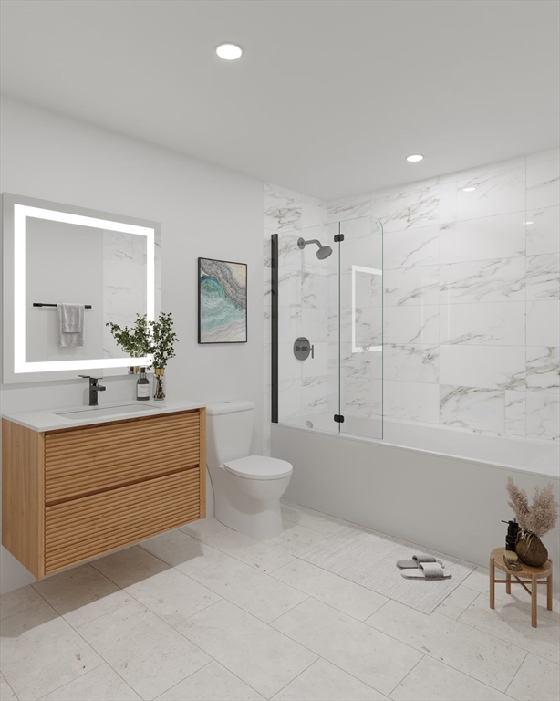 84 Prospect Street, Unit 104 Somerville, MA 02143 - Photo 5 of 7 a bathroom with a sink a toilet and shower