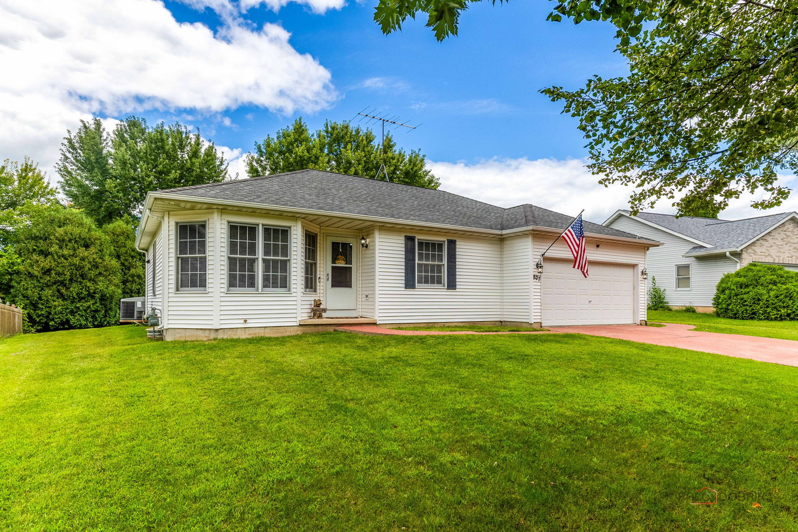 807 Aspen Way Genoa, IL 60135 - Photo 1 of 29 a front view of a house with a garden