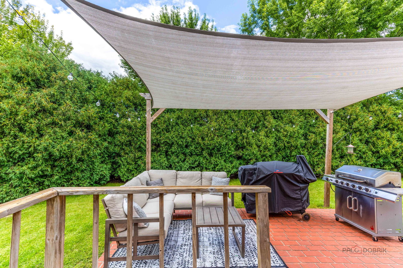 807 Aspen Way Genoa, IL 60135 - Photo 23 of 29 a view of a patio with table and chairs potted plants with wooden floor and fence