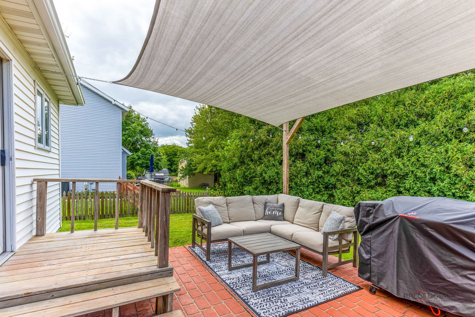 807 Aspen Way Genoa, IL 60135 - Photo 24 of 29 a view of a patio with a table chairs and a backyard