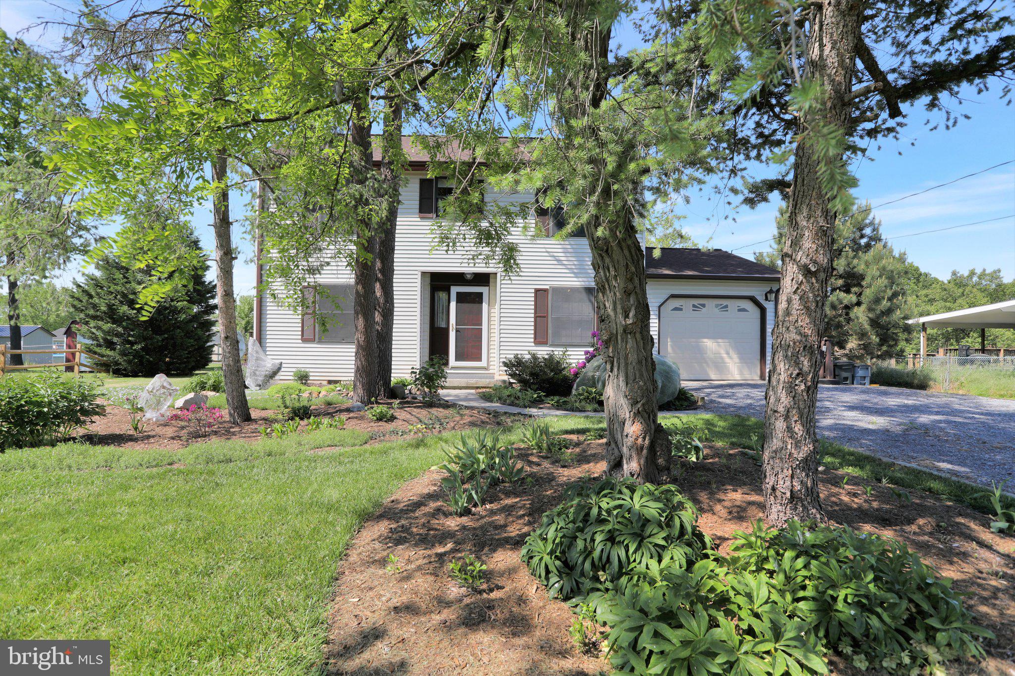 44 Harding Lane Inwood, WV 25428 - Photo 2 of 27 Custom landscaping (protected from cicadas)