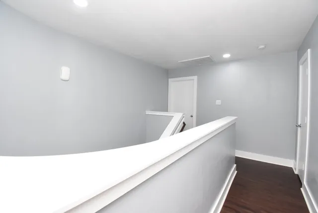 a hallway with a white cabinets