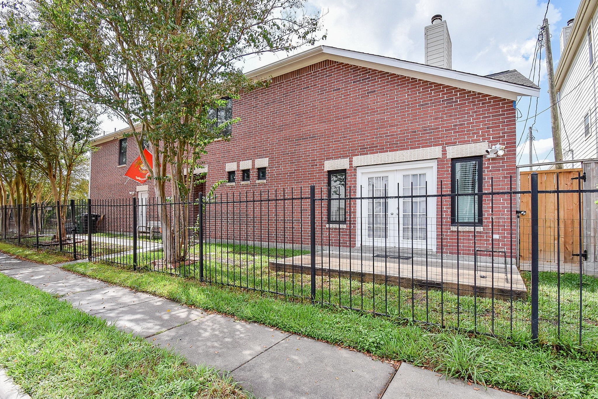 3720 Link Valley Houston, TX 77025 - Photo 4 of 25 a view of a brick house in front of a yard with plants and large trees